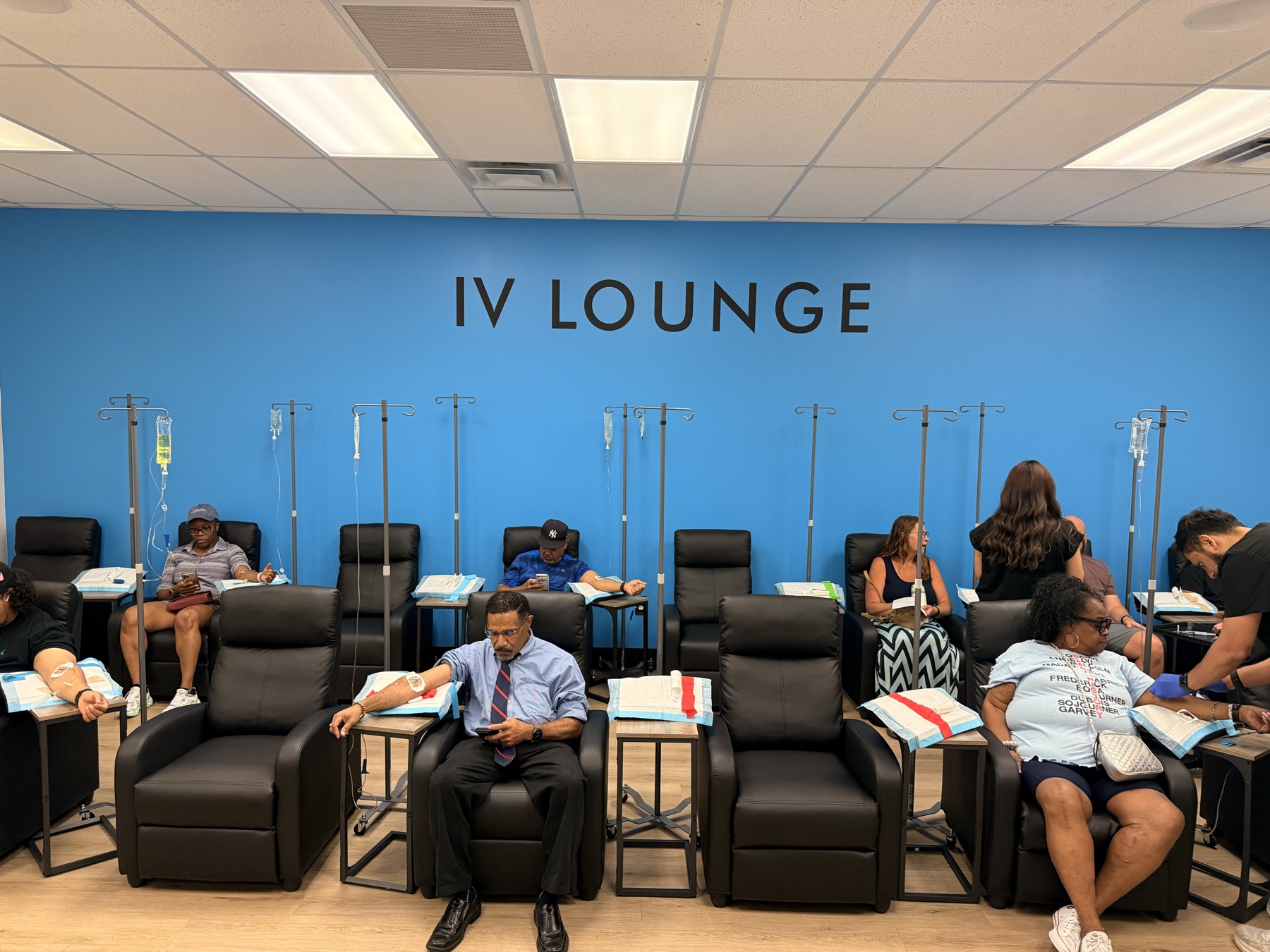 Guests relaxing in the Wellness Docs IV Lounge during our last event