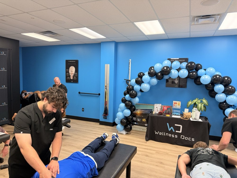 A guest getting a free hands-on massage at a Wellness Docs event